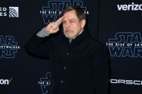 Mark Hamill bid farewell to the franchise that launched his career in style at a futuristic hanger filled with life-size X-Wing fighters in Los Angeles