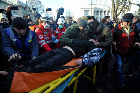 An injured protester receiving aid