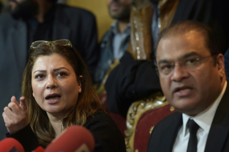 Mehrene Malik Adam (L), general secretary of the All Pakistan Muslim League (APML), the party of former military ruler Pervez Musharraf, speaks during a press conference with Musharraf's lawyer Salman Safdar (R), after the death sentence ruling