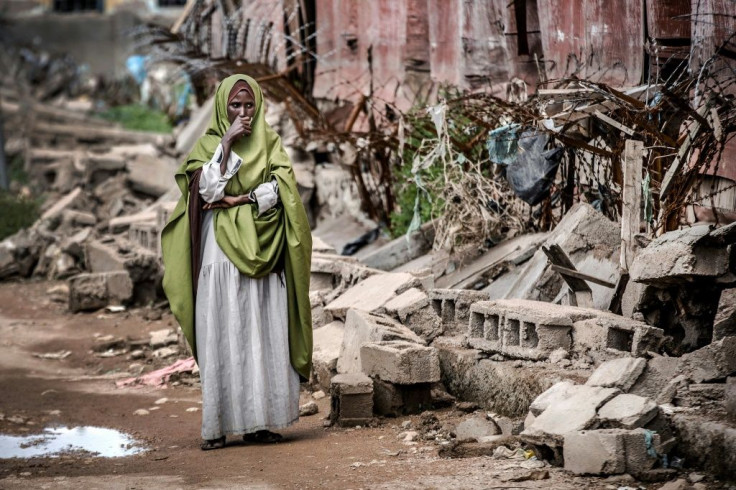 Devastation: A woman looks at the remains of the school in flood-hit Beledweyne