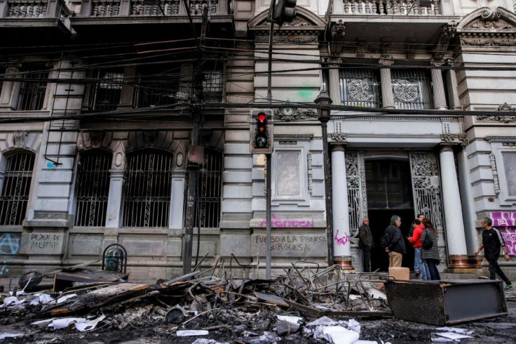 The El Mercurio newspaper building was set on fire during weeks of protests in Chile