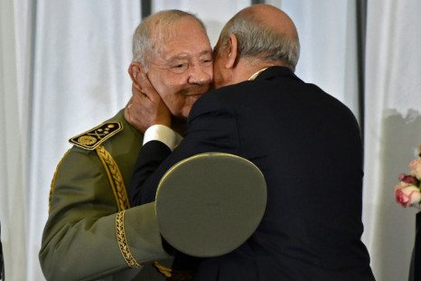 Algeria's newly inaugurated president embraces armed forces chief Lieutenant General Ahmed Gaid Salah, who has been the country's de facto strongman since veteran leader Abdelaziz Bouteflika was forced to step down in April