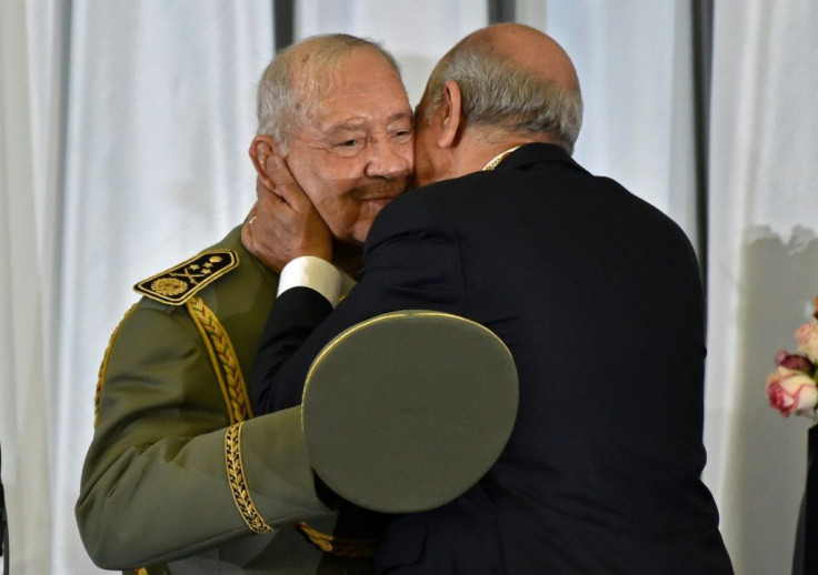 Algeria's newly inaugurated president embraces armed forces chief Lieutenant General Ahmed Gaid Salah, who has been the country's de facto strongman since veteran leader Abdelaziz Bouteflika was forced to step down in April
