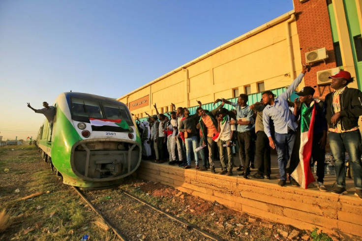 Hundreds of people crammed into a train to the cradle of Sudan's uprising to mark the first anniversary of the start of the protests