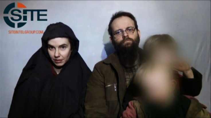 In this undated video grab provided by Site Intelligence Group and released by AFP in October 2017, hostages Caitlan Coleman (L) and her husband Joshua Boyle speak to the camera holding their children in an undisclosed location