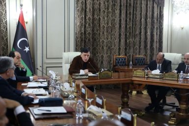 Libya's UN-recognised Prime Minister Fayez al-Sarraj (C) presided over a cabinet meeting where the implementation of a military deal with Turkey was 'unanimously approved'