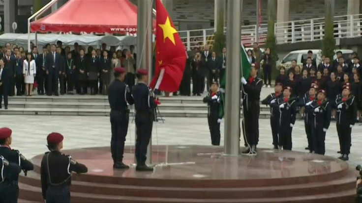 IMAGESChina and Macau flags are are raised to mark 20 years since the former colony was returned to China.