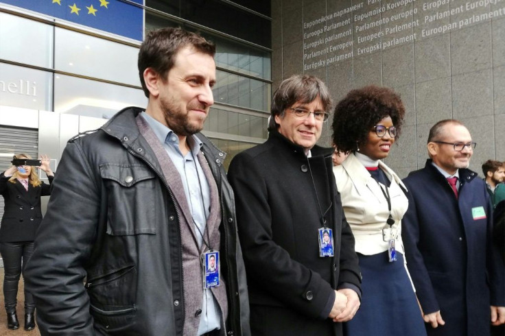 Former Catalan regional president Carles Puigdemont (centre-left) and his health minister Toni Comin (left) were elected to the European Parliament in May