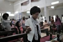 A Sudanese Christian woman prays during a Sunday service at the All Saints Cathedral in Khartoum in August 2019 amid rising hopes for religious freedom in Sudan