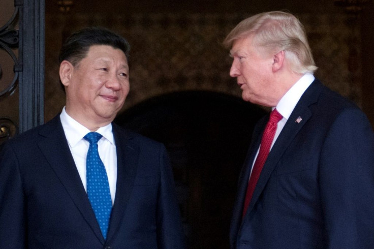 US President Donald Trump (R) said he and Chinese counterpart Xi Jinping discussed North Korea and Hong Kong