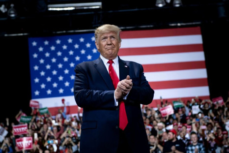At a rally in the swing state of Michigan Trump said the economy would be his shield against any assault from the eventual Democratic challenger in 2020