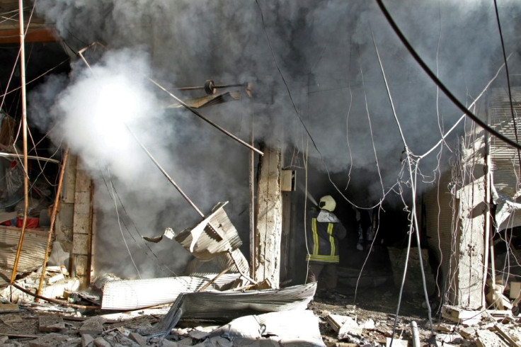 Smoke billows from a building following a reported bombardment by pro-Syrian government forces in the town of Maaret in Idlib province