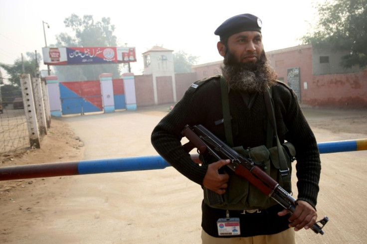 A policeman stands guard outside the central jail in Multan where Hafeez was sentenced to death