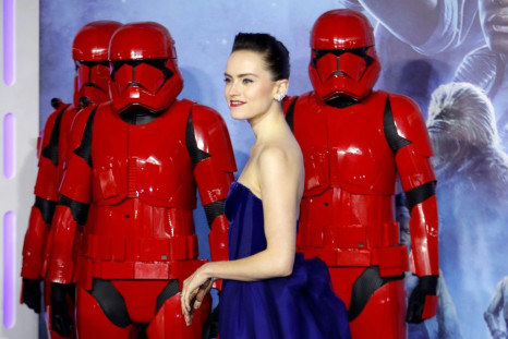 British actor Daisy Ridley poses with stormtroopers upon arrival for the European premiere of Disney's "Star Wars: The Rise of Skywalker" in London on December 18, 2019