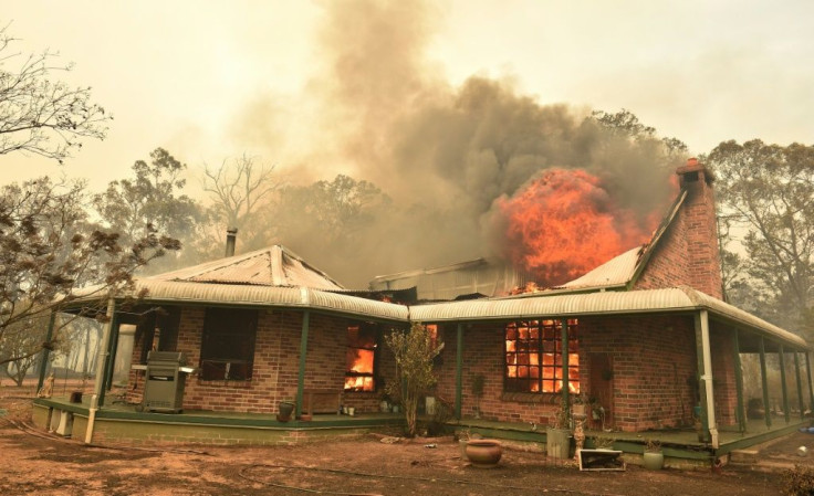 A property burns from bushfires in Balmoral, 150 kilometres southwest of Sydney on December 19, 2019.