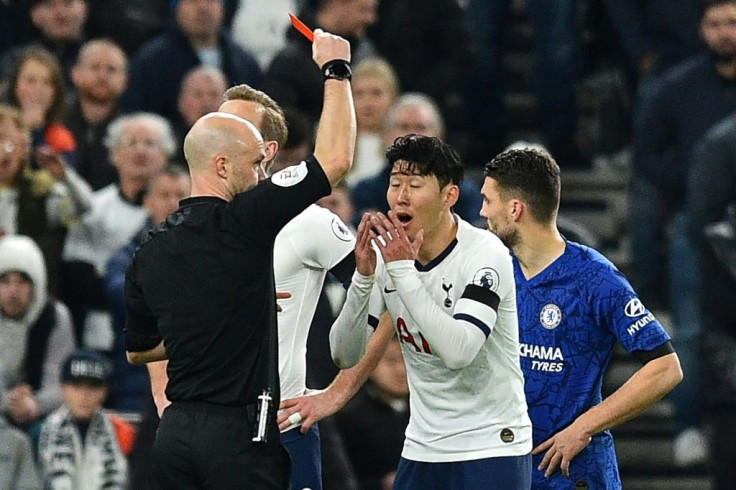 Son Heung-min is shown the red card after he kicked out at Antonio Rudiger
