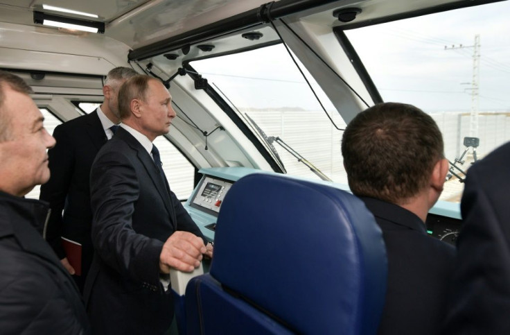 Russian President Vladimir Putin rides a train connecting the Crimea to mainland Russia