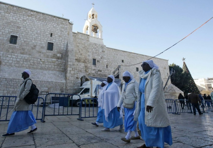 Christian pilgrims visit the Church of the Nativity in the West Bank city of Bethlehem, ahead of midnight mass