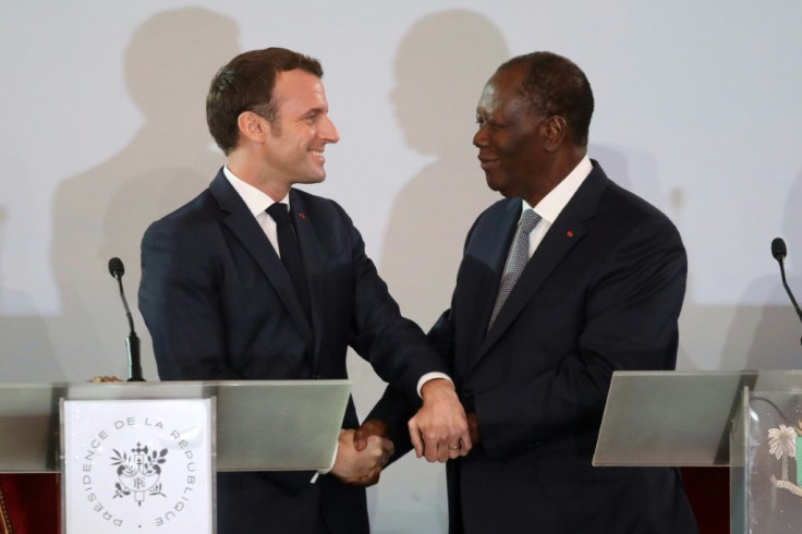Handshake: Macron and Ouattara at their press conference in Abidjan last Saturday
