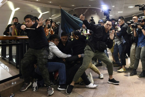 Riot police used pepper spray and batons to beat back angry crowds after plainclothes officers made arrests inside Hong Kong's Harbour City, a luxury mall