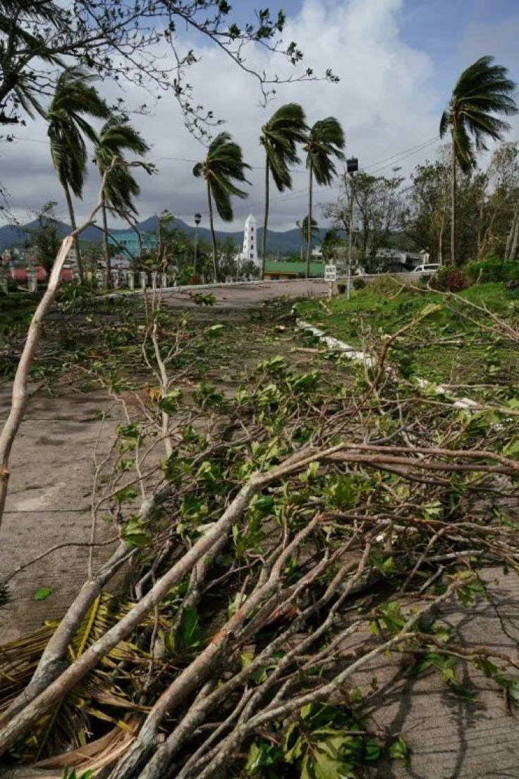 Tens of thousands were stranded at shuttered ports or evacuation centres as typhoon Phanfone leapt from one small island to another in the central Philippines