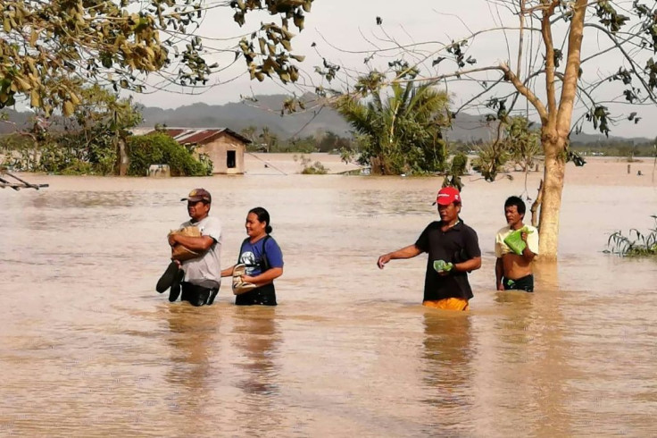 Parts of the central Philippines have been half-submerged by brown-coloured floods