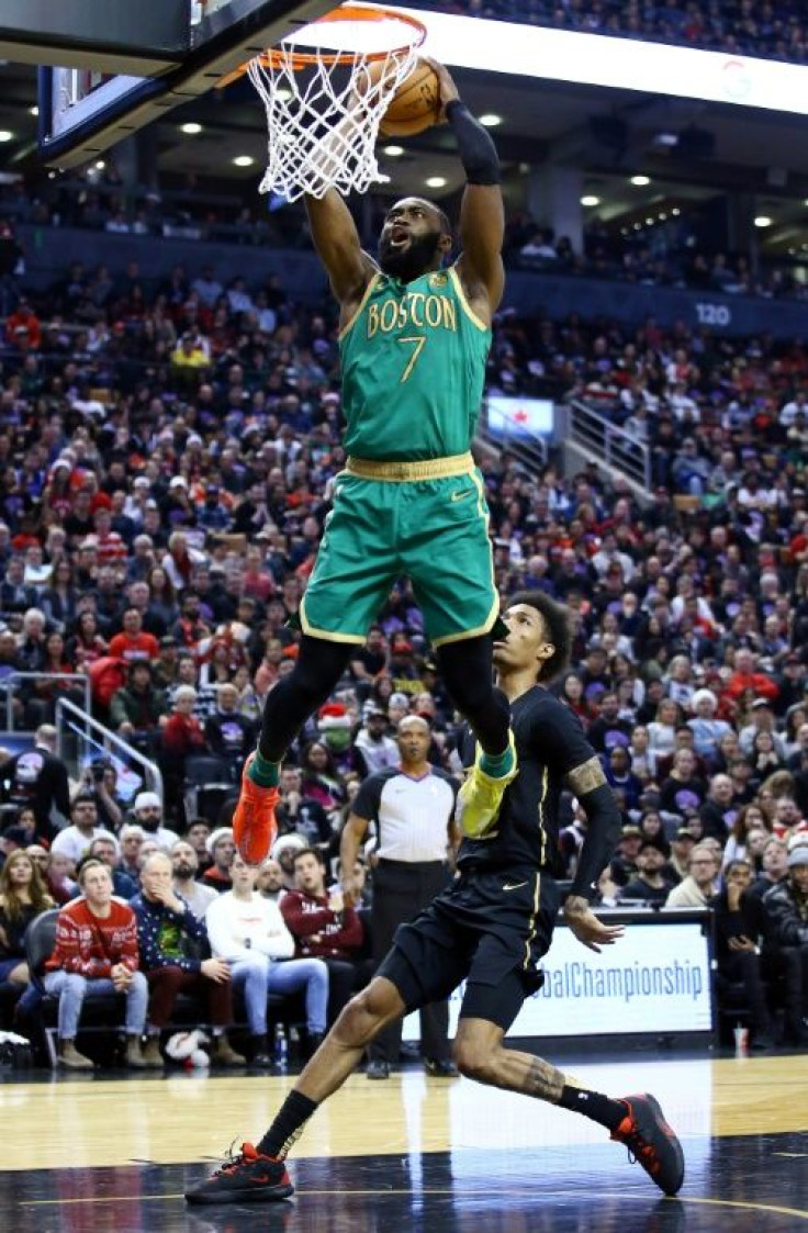 Boston's Jaylen Brown dunks on the way to scoring 30 points in the Celtics' 118-102 NBA victory over the Raptors in Toronto
