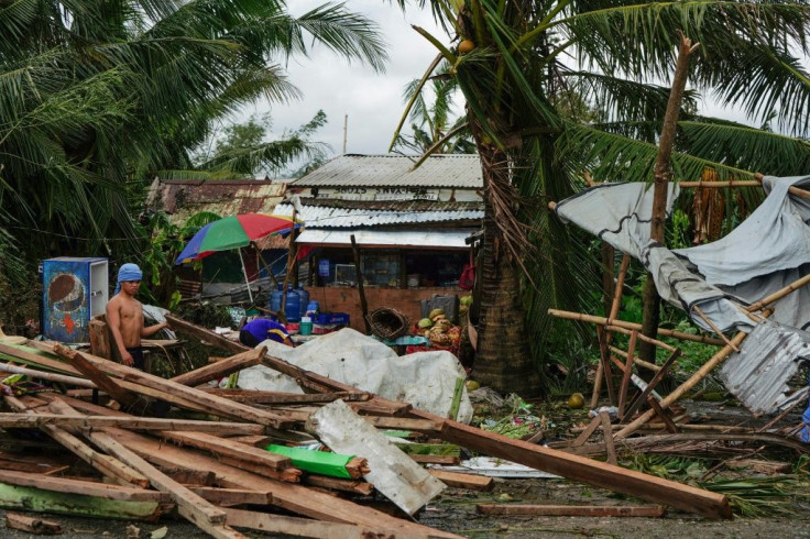 Typhoon Phanfone swept across the central Philippines on Christmas Day, tearing roofs off houses