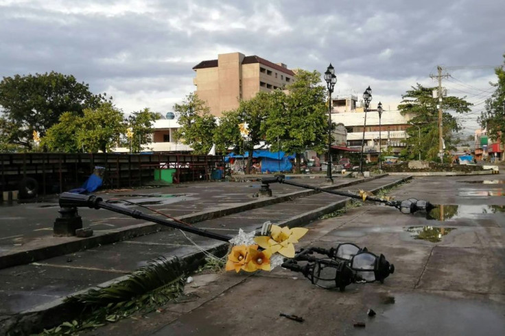 Lamp posts damaged due to typhoon Phanfone lie on a road in Ormoc City