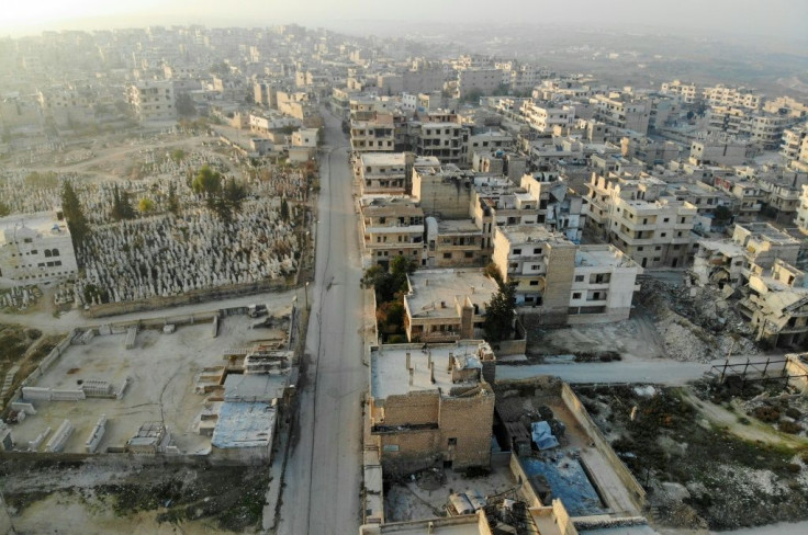A drone picture taken on December 23, 2019 shows empty streets and damaged buildings in the town of Maaret Al-Numan in the northwestern Idlib province