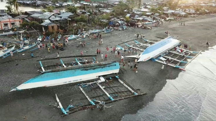Boats are capsized on a beach in Occidental Mindoro after Typhoon Phanfone, with wind gusts reaching 200 kilometres (125 miles) an hour, tore roofs off houses and toppled electric posts in the central Philippines on Christmas day 2019.