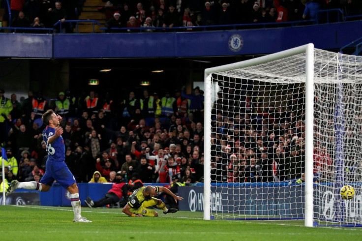 Nathan Redmond (centre) slides in to double Southampton's lead at Stamford Bridge