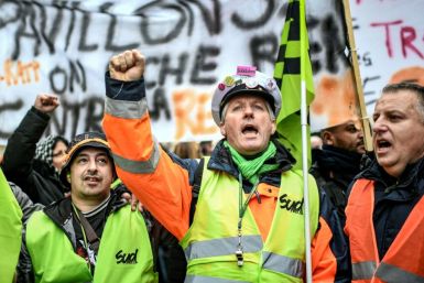 Strikers at a demonstration near Gare de l'Est train station in Paris on December 26. The reasons for strikes, analysts say, are multiple and complex, and touch on the French republic's revolutionary origins, its educational philosophy, union traditions a