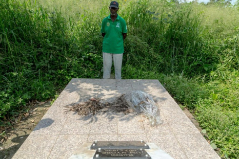 Louis Marie Mang, a UPC activist, stands before the tomb of anti-colonialist leader Ruben Um Nyobe