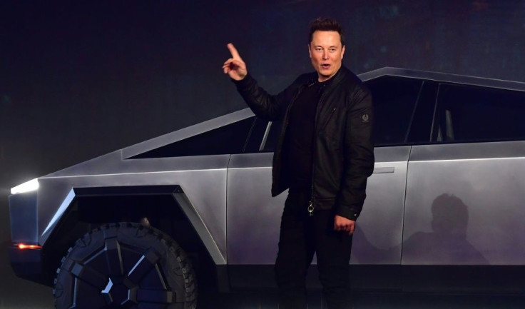 Elon Musk is seen introducing a new battery-powered Tesla truck in Hawthorne, California on November 21, 2019; his new people-moving tunnel system in Las Vegas will use Tesla chassis