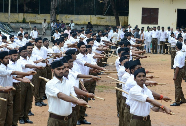 Members of the RSS, the militaristic parent organisation of India's ruling BJP, use lathis in their morning drills