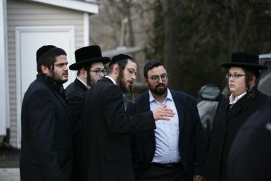 Members of the Jewish community gather outside the home of rabbi Chaim Rottenbergin Monsey, in New York on December 29, 2019 after a machete attack that took place earlier outside the rabbi's home during the Jewish festival of Hanukkah