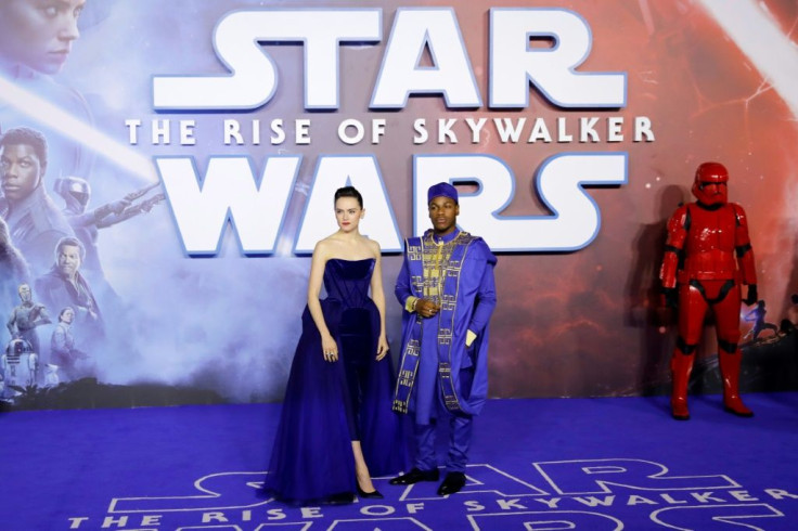 This file photo taken on December 18, 2019 shows actors Daisy Ridley and John Boyega posing upon arrival for the European premiere in London of 'Star Wars: The Rise of Skywalker'