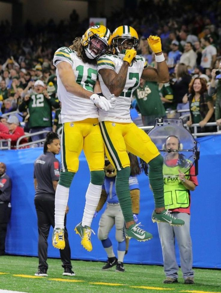 Comeback: Davante Adams of the Green Bay Packers celebrates a touchdown with teammate Jake Kumerow in the fourth quarter of the Packers' NFL victory over the Detroit Lions