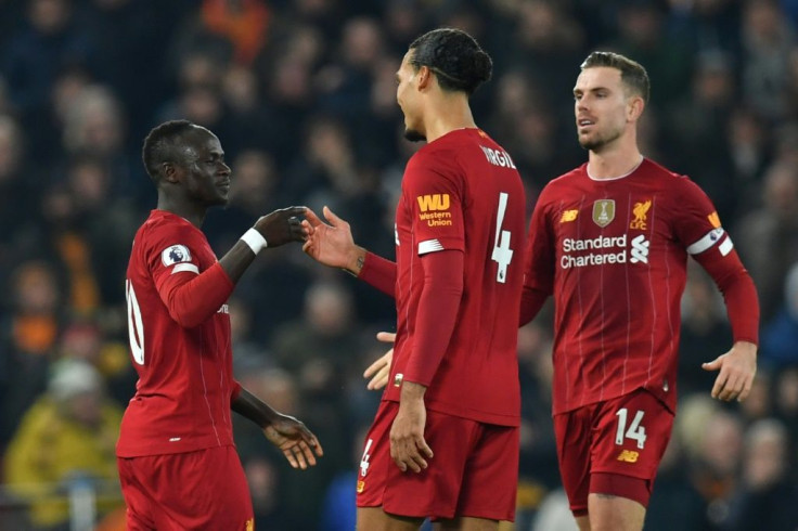 Sadio Mane (left) celebrates the only goal as Liverpool beat Wolves 1-0