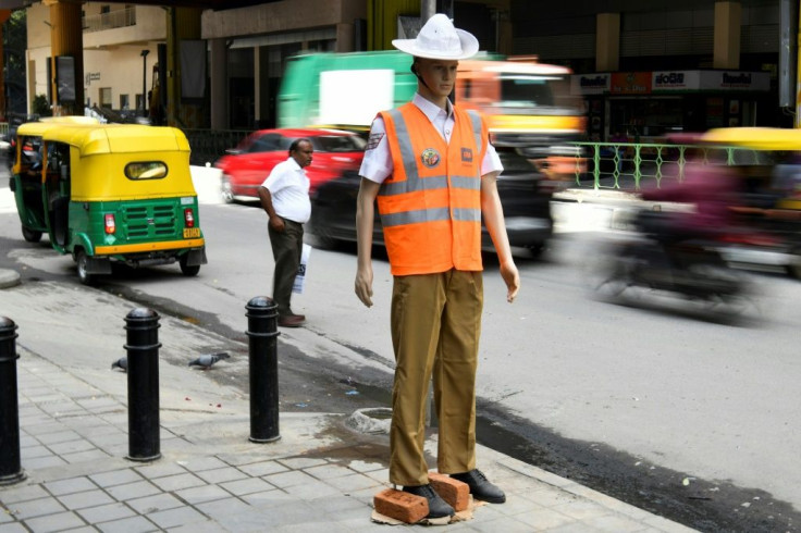Model officer: police in the Indian city of Bangalore are hoping the dummies will deter traffic offenders
