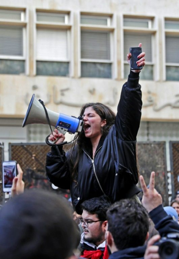 A Lebanese protester in front of the central bank headquarters in the capital Beirut