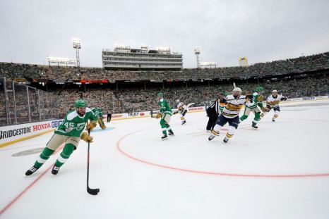 Roman Polak #45 of the Dallas Stars moves the puck against the Nashville Predators during the game, part of an annual outdoor NHL series