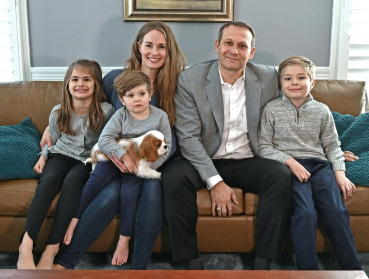 Johan's older brother Thomas (R) donated the bone marrow used in the therapy that cured Johan (holding puppy); with them in the picture (L to R) are sister Joanna, mother Maren and father Ricardo