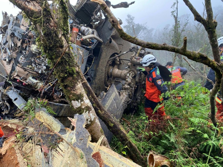 Rescuers searching for survivors after a military Black Hawk helicopter smashed into mountains in Yilan county near Taipei, killing the island's top military chief, Shen Yi-ming