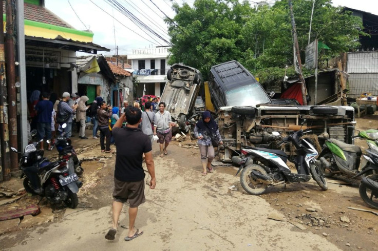The floods turned neighbourhoods into wastelands of debris and overturned cars