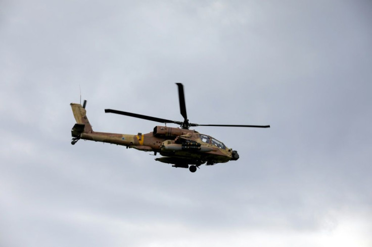 An Israeli army helicopter flies over the annexed Golan Heights