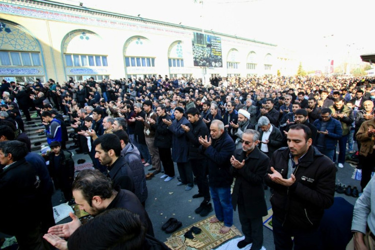 Iranian worshippers attend prayers for slain Revolutionary Guards commander Qasem Soleimani in Tehran on January 3, 2020 as the country's top security body vows to avenge his death in "the right place and time"