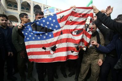 Iranians burn a US flag during a demonstration against American "crimes"
