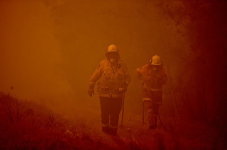 Towering bushfires in Australia have turned the sky red and forced thousands from their homes